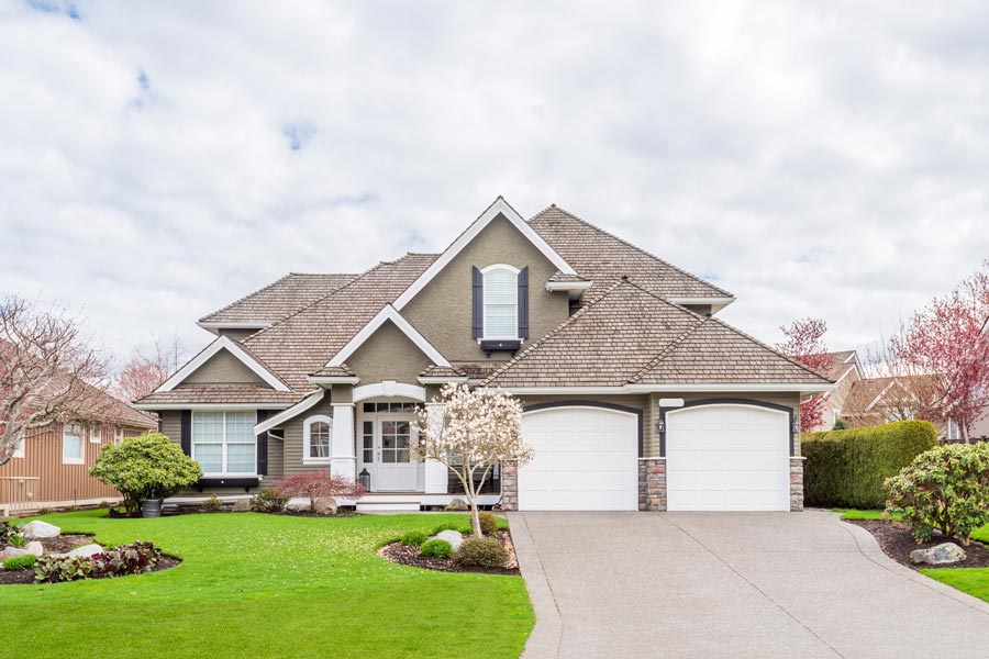 A typical American home with beautiful finishes and green front yard.