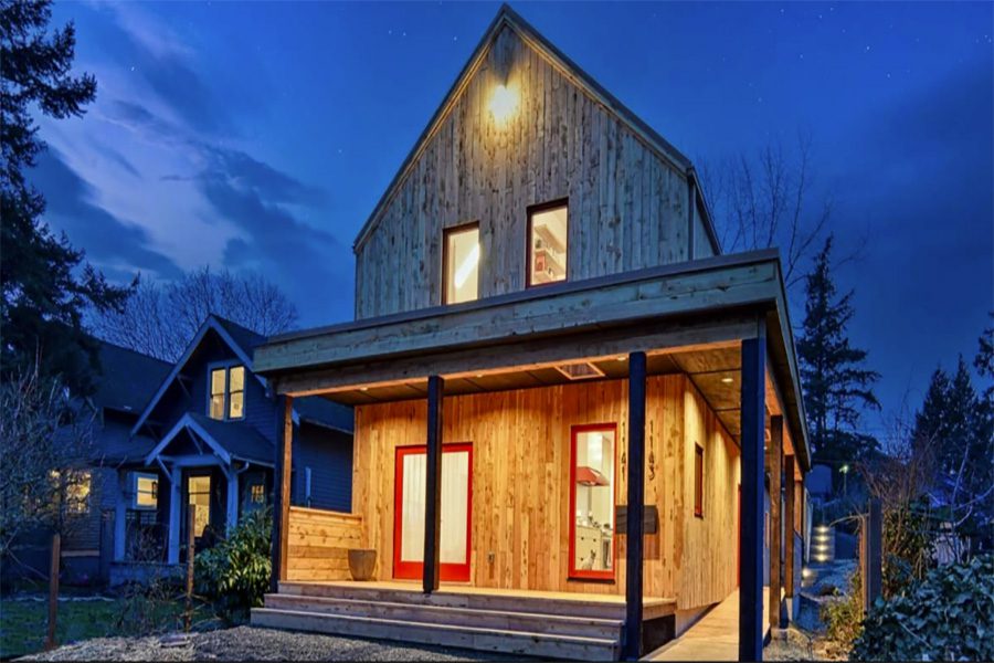 Felicity House, Green Builder’s Green Home of the Year grand winner house. Tall wooden house at night.