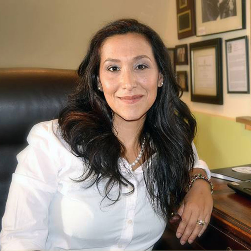 Smiling photo of Leticia Colon de Mejias in an office