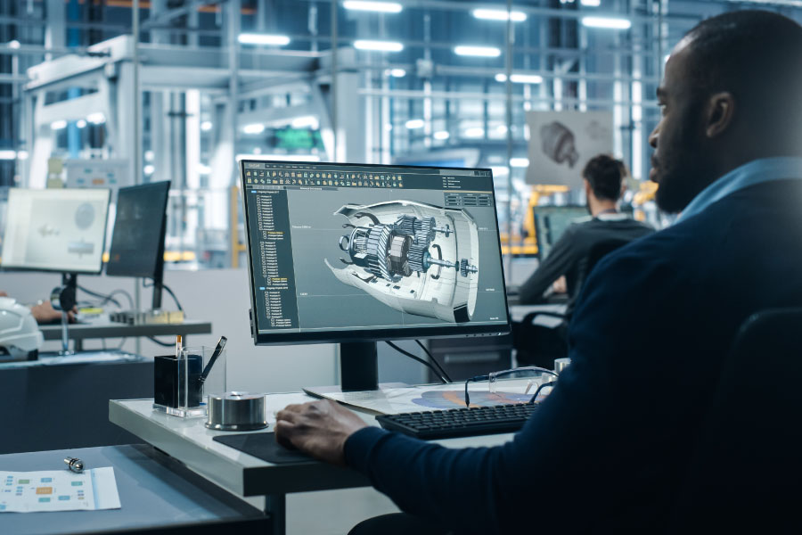 Man works on a 3D model in a modern office.