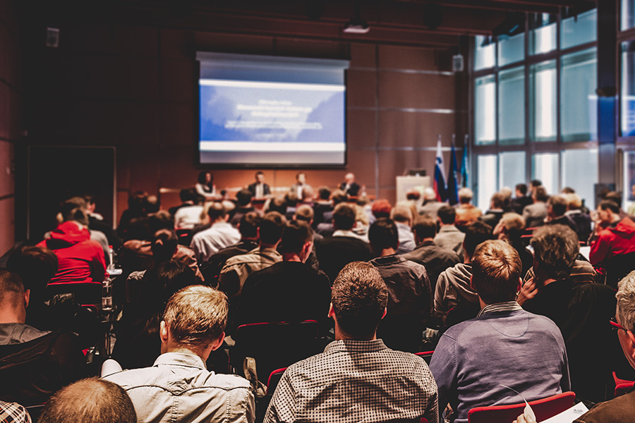 Photo of a full educational session at a conference.