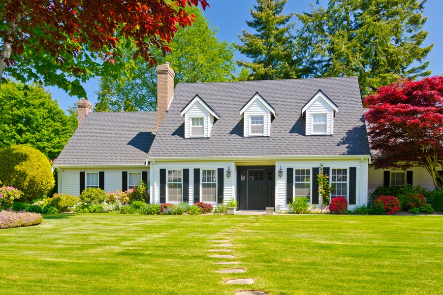 Traditional American home with green yard