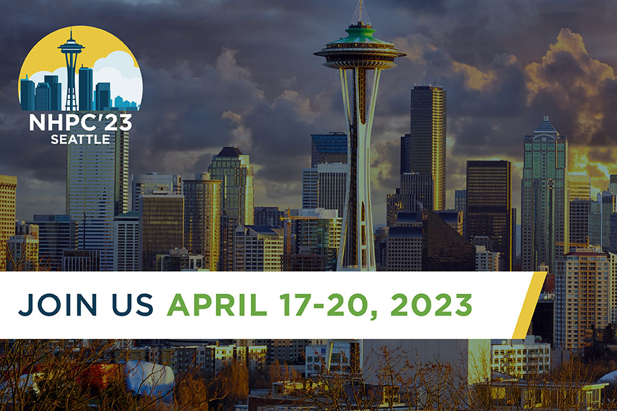 Photo of Seattle skyline with text on top reading, "Join us April 17-20, 2023"