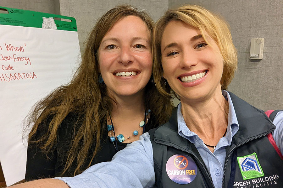 Two women pose and take a selfie together at a BPA event.