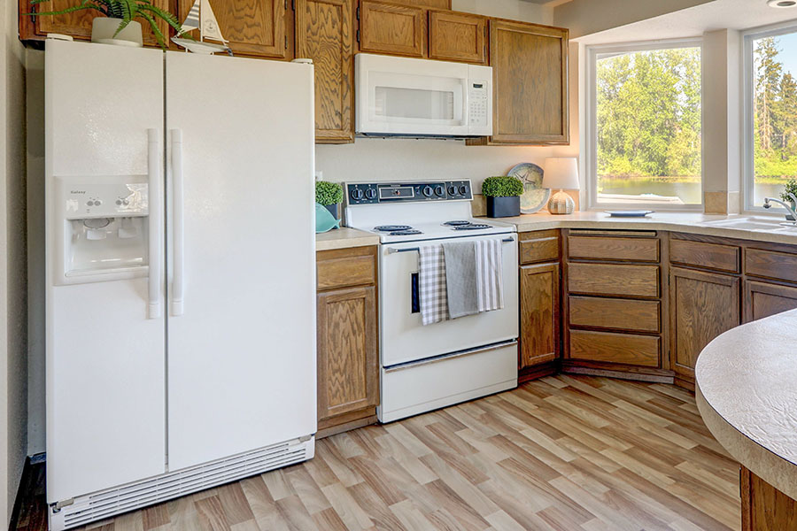 Photo of a kitchen with older finishes