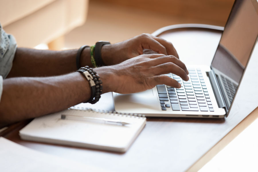 Typing on a computer to apply for BPA conference scholarship funds.