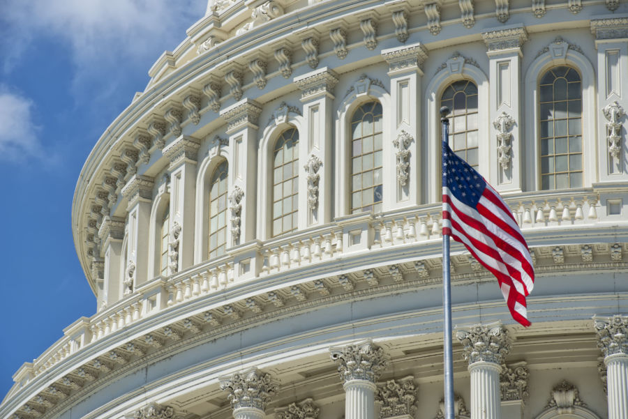 Washington DC Capitol building with U.S. flag out front