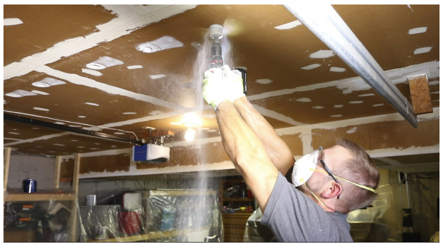 A photo of a man performing construction.