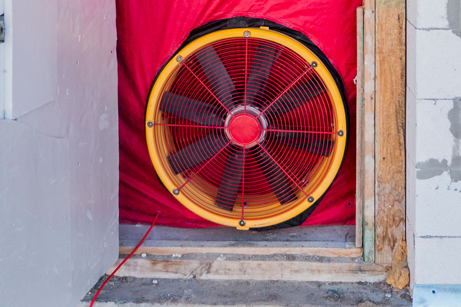 Blower door test inside of a door in a home, showcased from the outside.