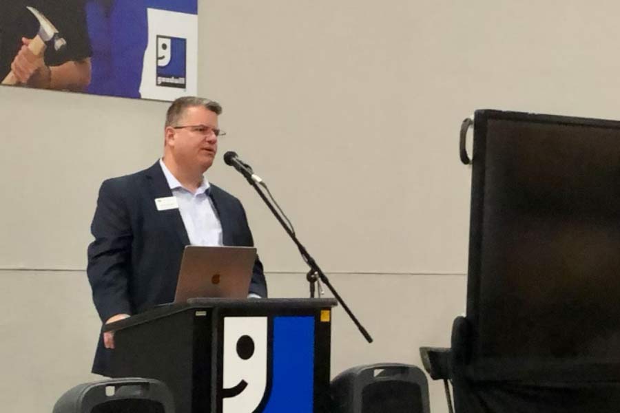 CEO Steve Skodak speaking at podium during a Building Performance Association event