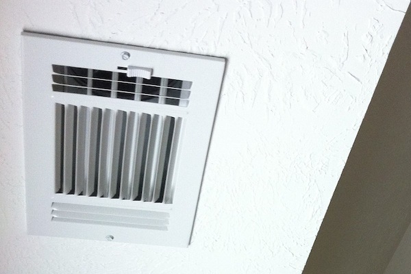 An open air vent on a ceiling