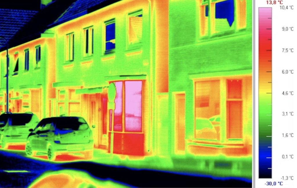 Infrard image of a row of buildings showing air leakage