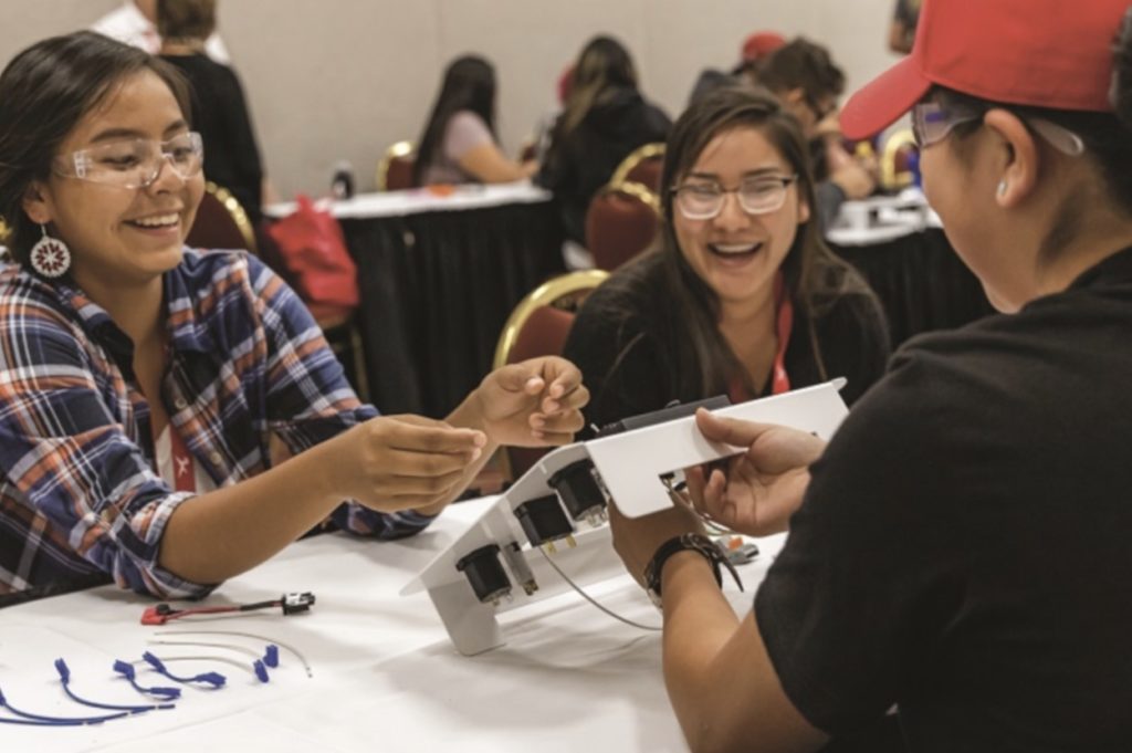 Students participate in a workshop facilitated by We Share Solar at an American Indian Science and Engineering Society event. 