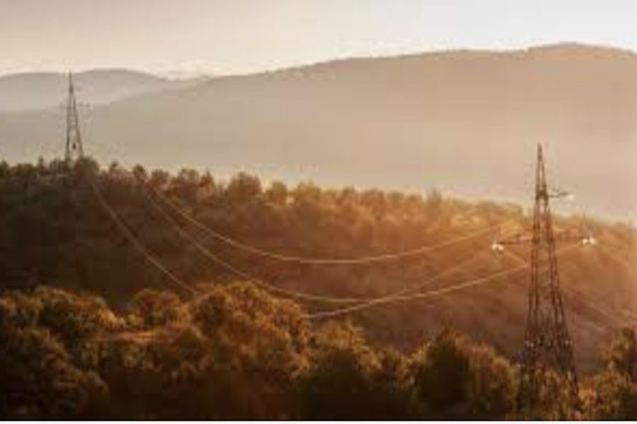 Electric wires in mountainous region representing the electric grid.