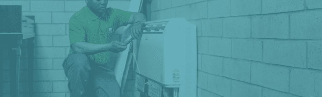 Technician working on a heat pump