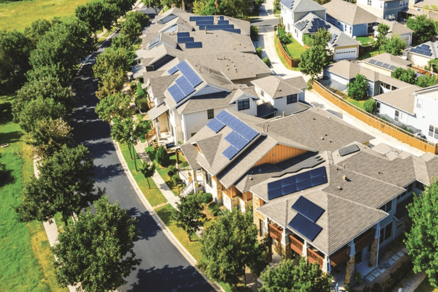 Solar panels on roofs of suburban neighborhood