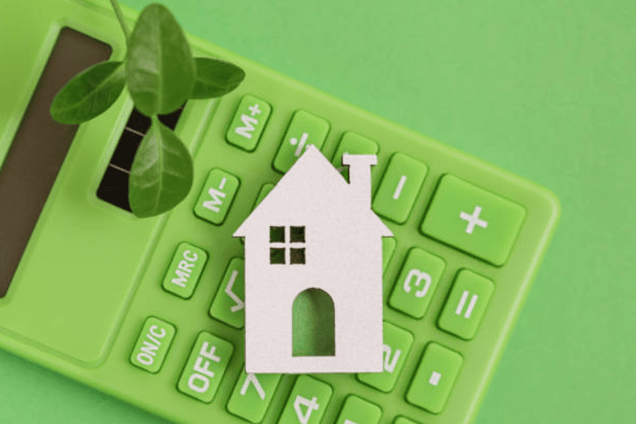 calculator with house graphic, green background