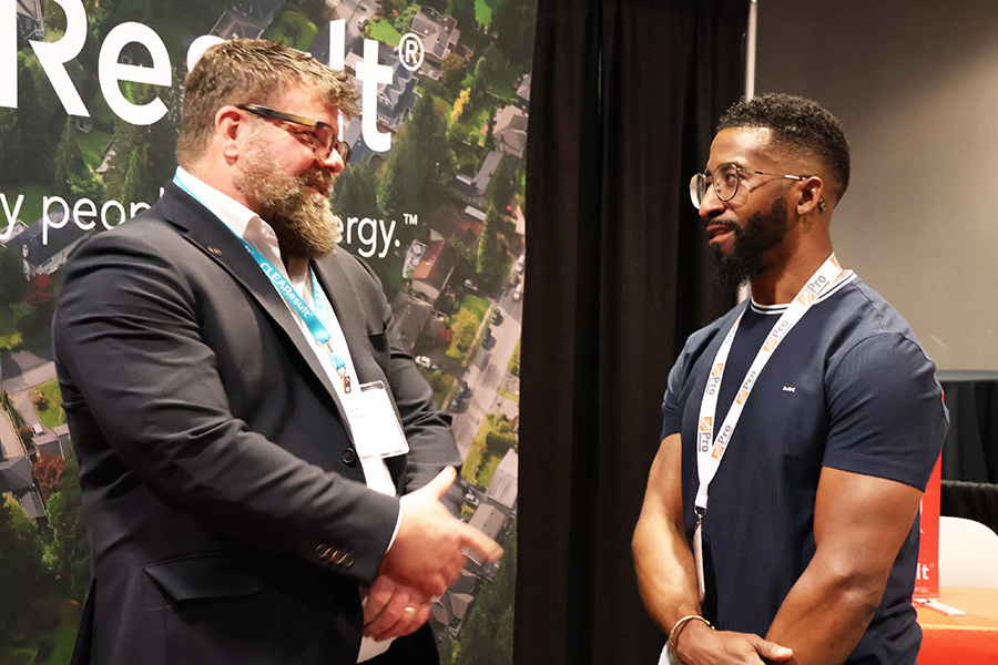 Two attendees at BPA's national conference having a conversation