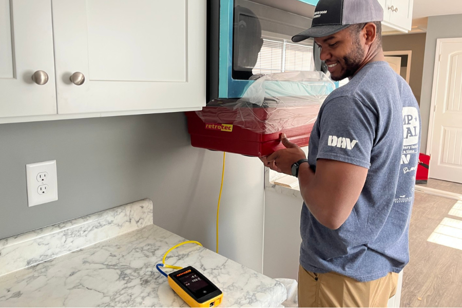 Green Door Energy employee doing testing in home