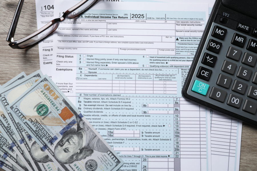 tax papers with money and calculator