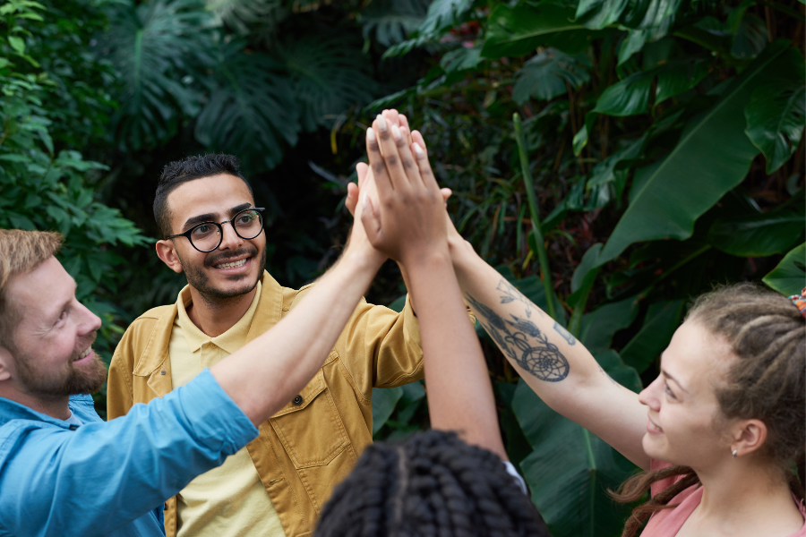 group of people high fiving