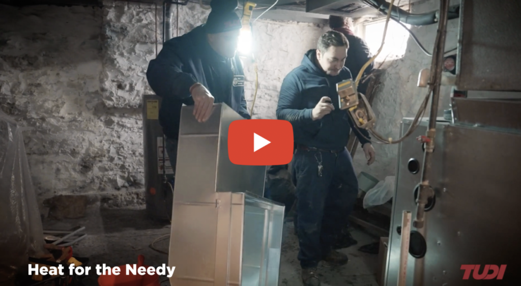 HVAC techs installing a furnace