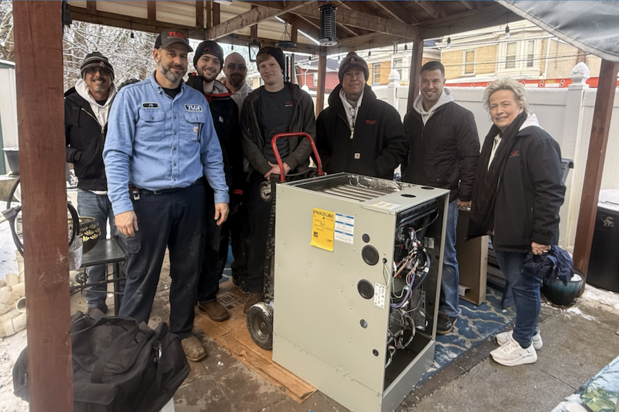 HVAC techs with homeowner