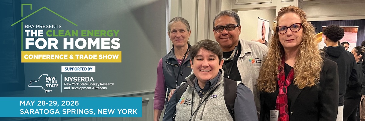 Group of four attendees at the Clean Energy for Homes Conference